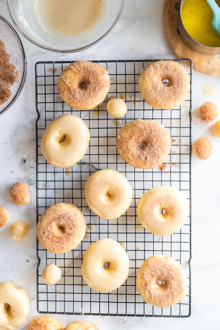 a tray of glazed donuts after baking 