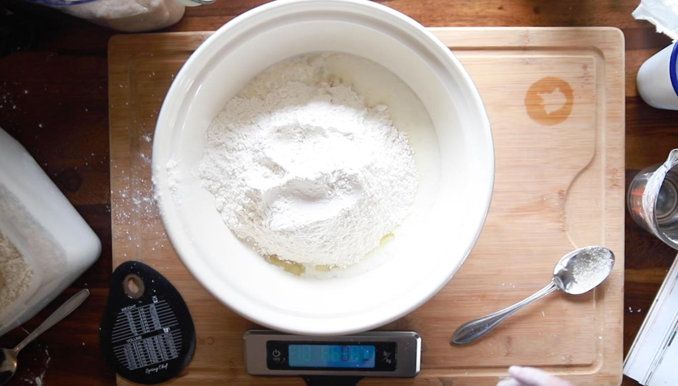 a bowl of flour on a countertop 