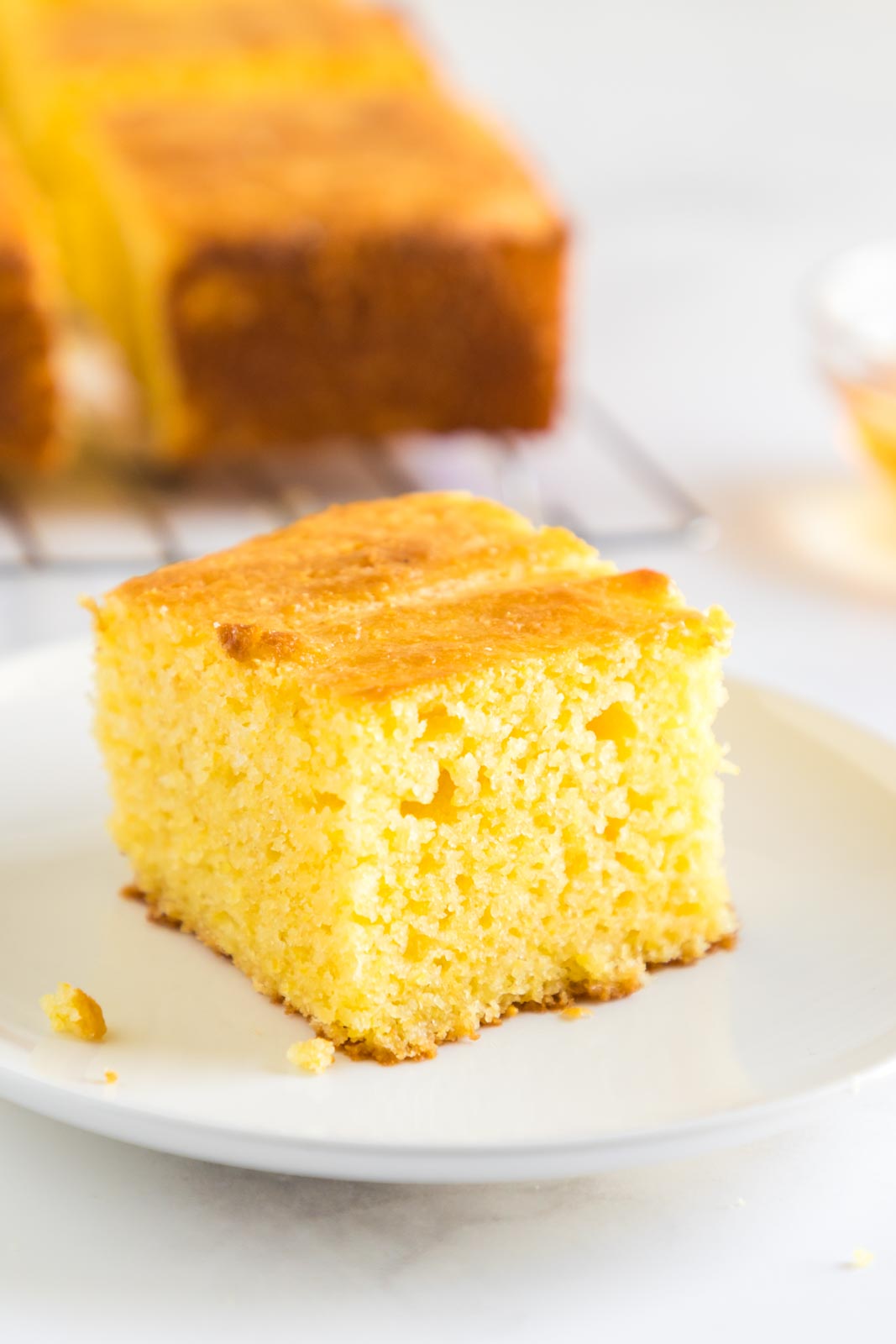 a square of jiffy cornbread on a plate 