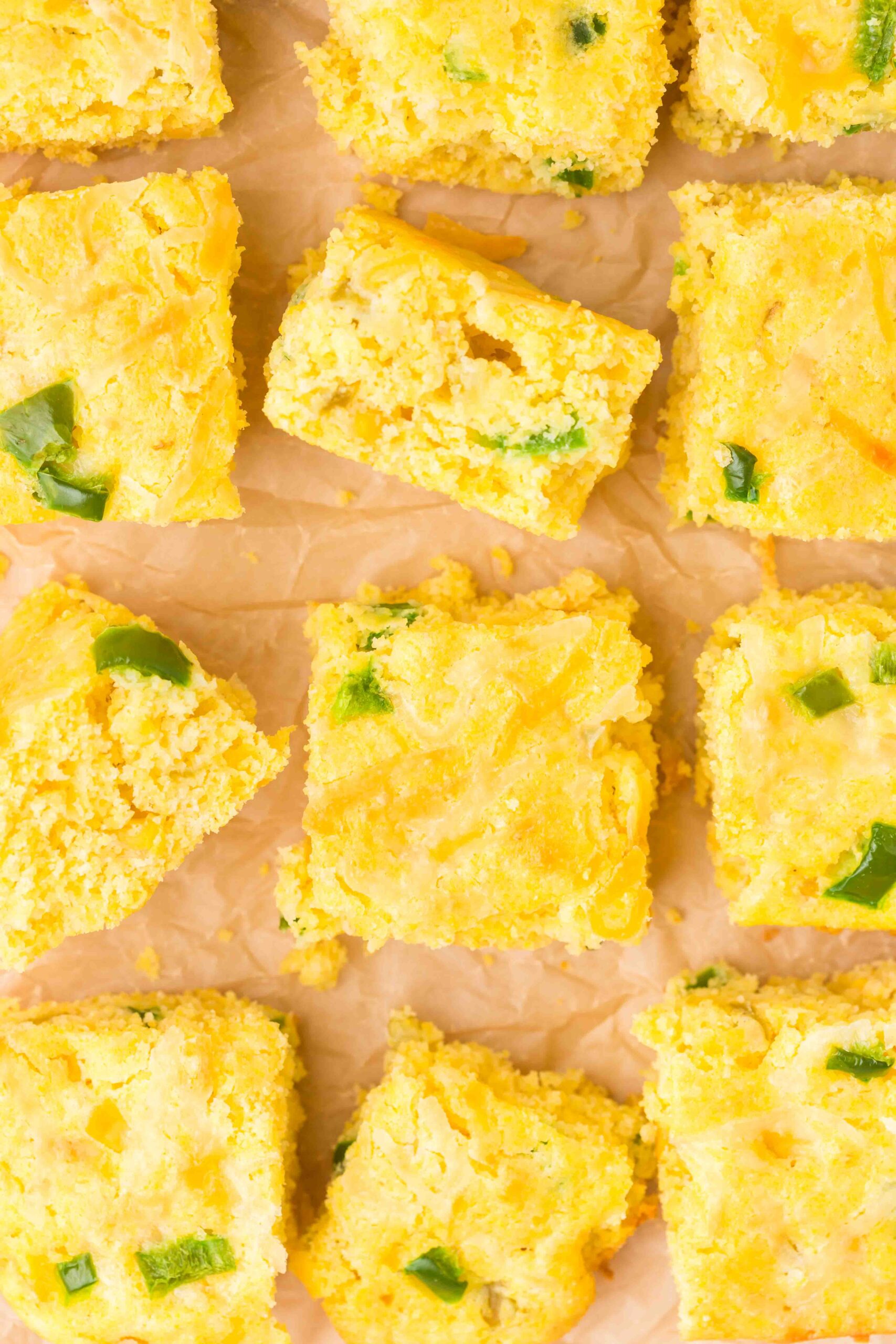 Overhead image of Mexican cornbread cut into squares.