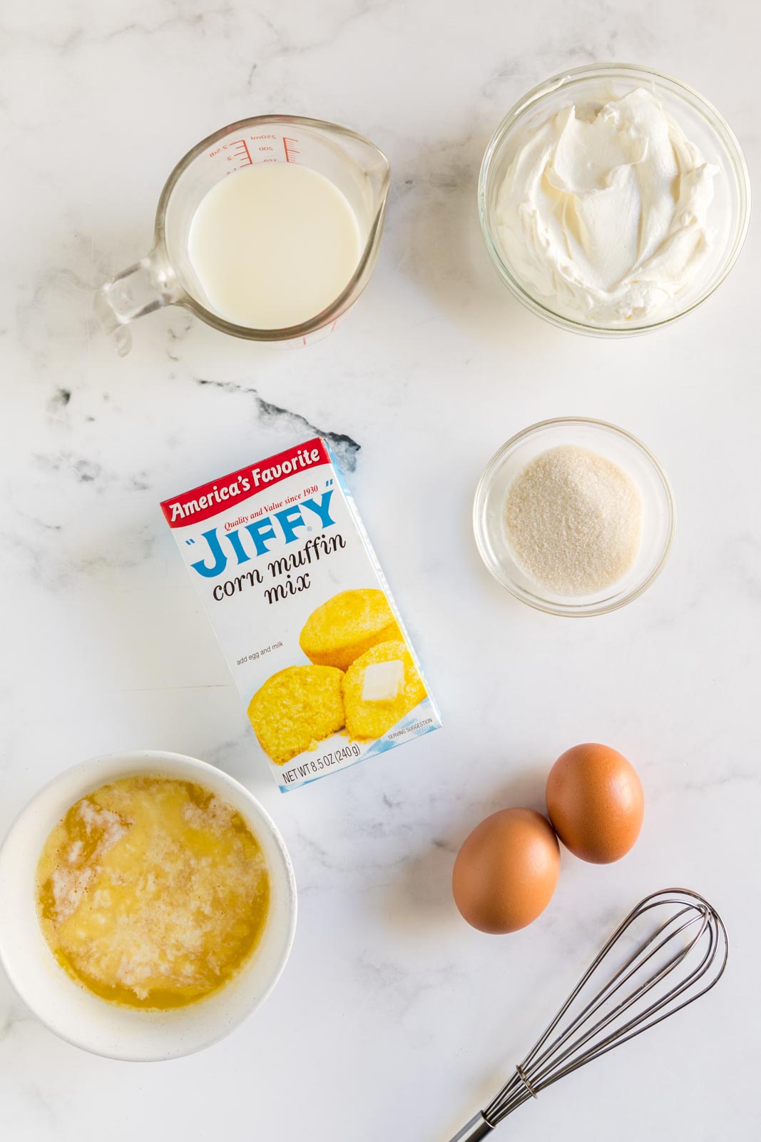 the ingredients for Jiffy cornbread laid out on a table 
