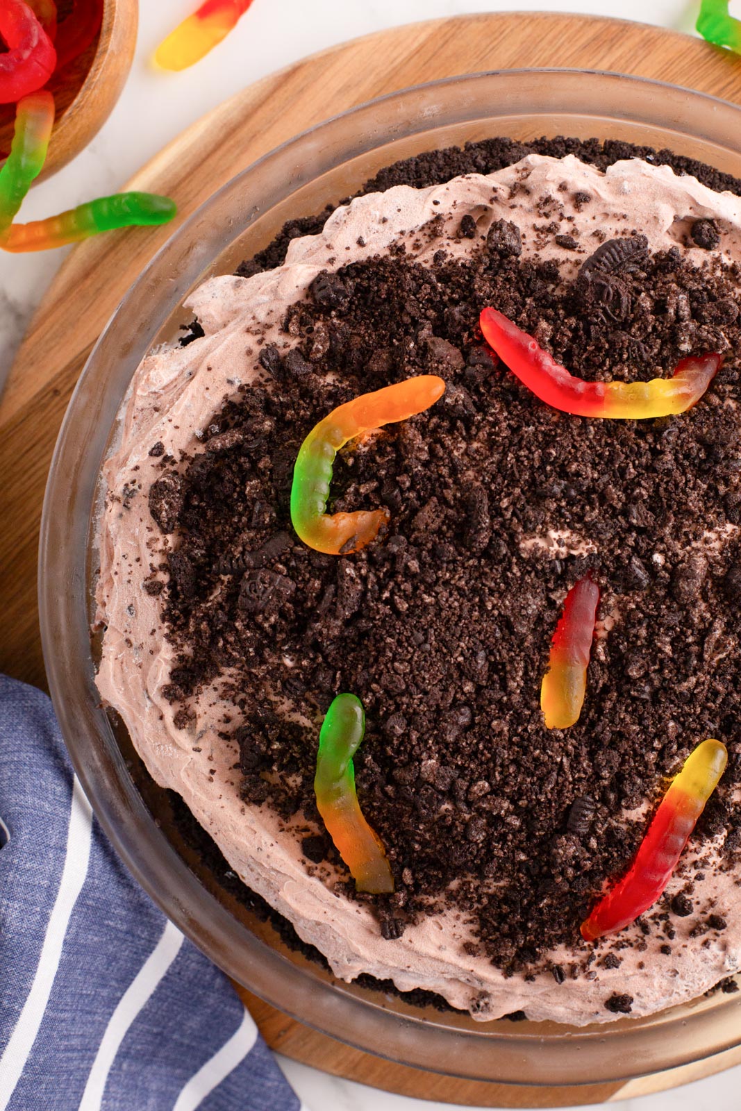 Overhead image of Oreo dirt pie with gummy worms.