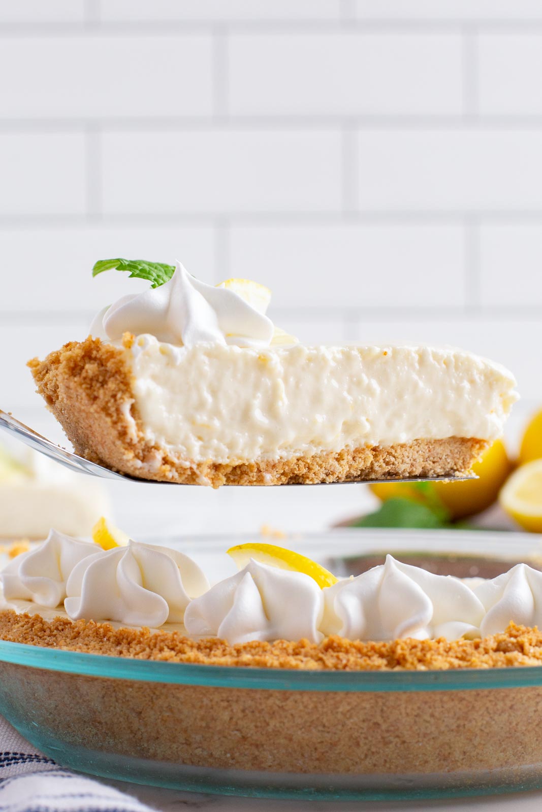 Taking a slice of Eagle Brand icebox lemon pie out of a pie dish.