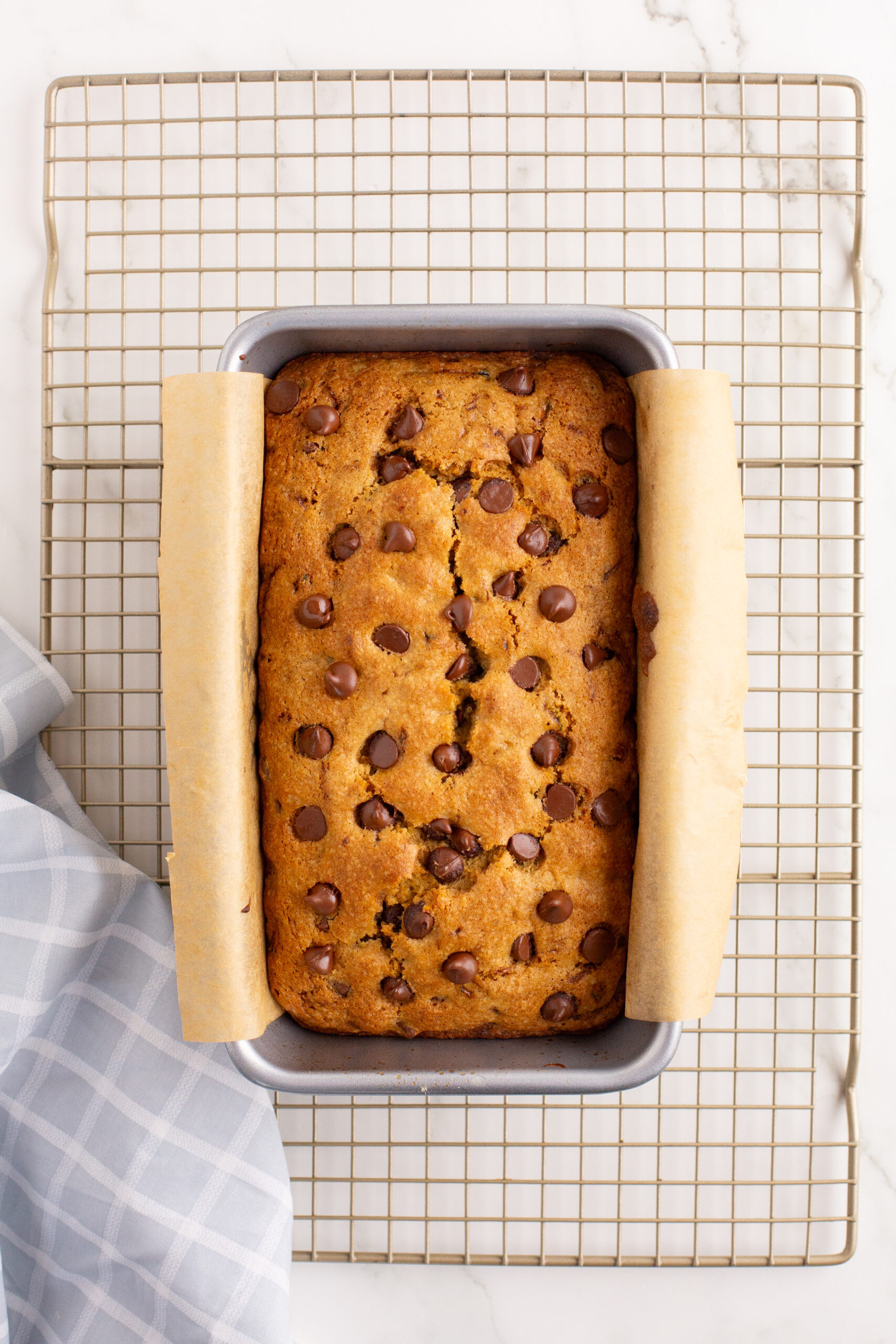 Overhead image of chocolate chip zucchini bread in a baking pan.