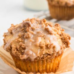 a baked and glazed coffee cake muffin on a table