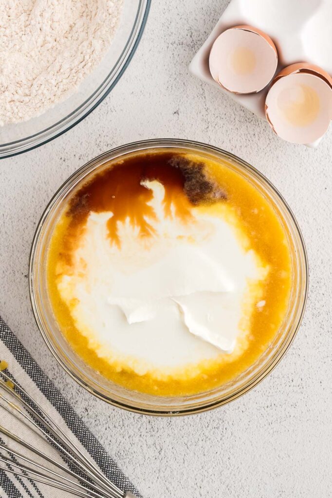 eggs, sour cream, buttermilk and vanilla in wet ingredients in a bowl 