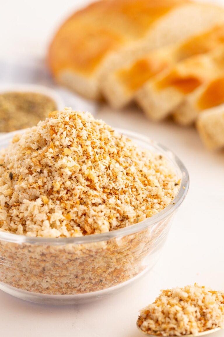 a bowl of bread crumbs on a table